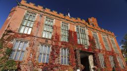 Firth Court with red vines growing up the walls - image
