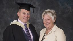 Stephen Sly receiving his Distinguished Alumni Award