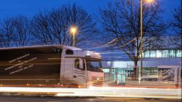 A delivery truck with ligh trails