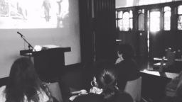Black and white image of a film screening