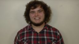 A profile picture of Russell Grim. He has on a tartan shirt.