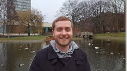 Jake Toth stood in Weston Park by a pond