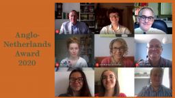 Students and staff with member of Anglo Netherlands society 