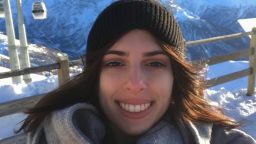 Nicolina on a skiing trip, at the top of a snowy mountain