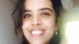 Anjana smiling, in front of a window