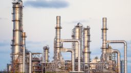 A large, modern petrochemical plant at dusk in the industrial district 