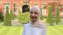 Profile photo of MSc student in front of a red brick building