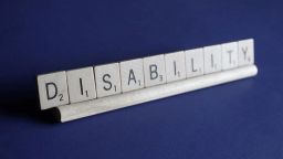 Scrabble pieces spell out DISABILITY