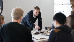 People discussing a project round a table