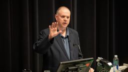 Prof Henk de Berg, talking with a raised hand