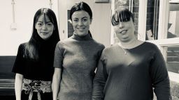 Three women smiling