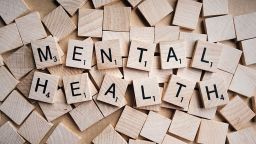 Scrabble pieces spelling out mental health