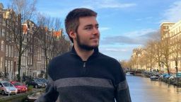Student Rober Heaney on a bridge in Amsterdam