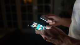 A man gambling on his smartphone