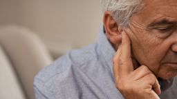 Senior man with hearing loss