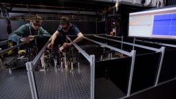Two researchers in the Lord Porter Ultrafast Laser Spectroscopy Laboratory