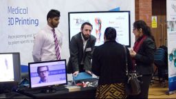 A group having a conversation at the Insigneo showcase 2017.