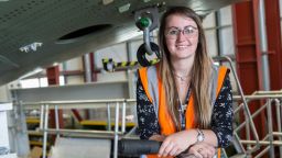 Josie Colclough, Lead Repair Design Engineer at Airbus, stood underneath the body of a plane