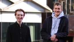 Two students looking at the camera