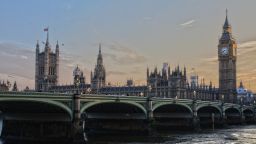 A photograph of the River Thames running alongside the Houses of Parliament.