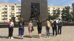 People looking at statue