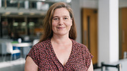 Laura Dean wearing a patterned top.