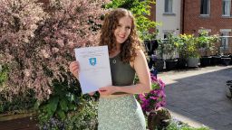 Amy Patterson holding her certificate