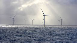 An offshore wind farm seen on a cloudy and windy day