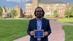 Jaime Delgadillo holding SPR award