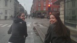 Politics student Caitlin riding a bike in Copenhagen
