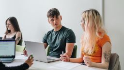 Two students talk in a seminar