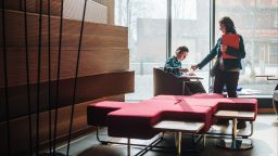 Two students studying in a library