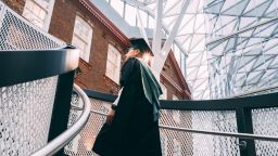 William Zheng in graduation gown in the Hearstpace
