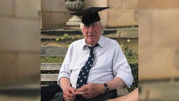 Sheffield alum, Brian Wildsmith, wearing a cap and looking fondly at the camera. 