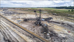 Huge open cast mining excavator, digging for ore