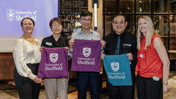 Sheffield alumni based in Singapore with Sheffield merchandise