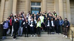 46 dental students stand together in a group smiling before setting off on the Mouth Cancer Foundationir 10 km fundraising walk for the
