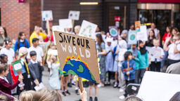 Children with climate placards