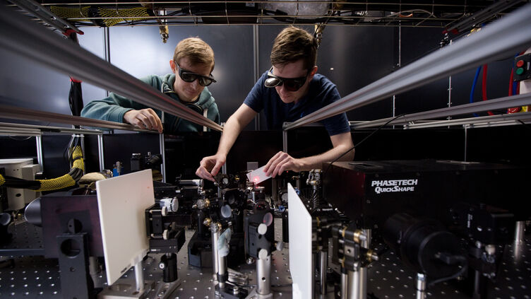 Two students using scientific facilities
